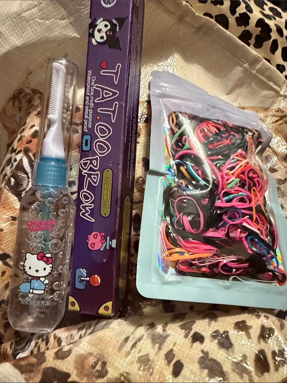 Hello Kitty Pink and Purple Cosmetic Kit with Bow Graphic filled with makeup